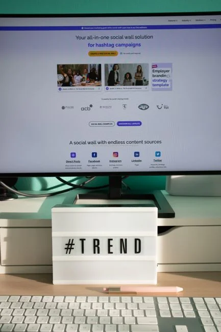 Small shopping cart on a laptop representing online shopping and e-commerce transactions.